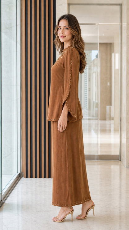 Side angle view of caramel brown long sleeve tunic and maxi skirt set