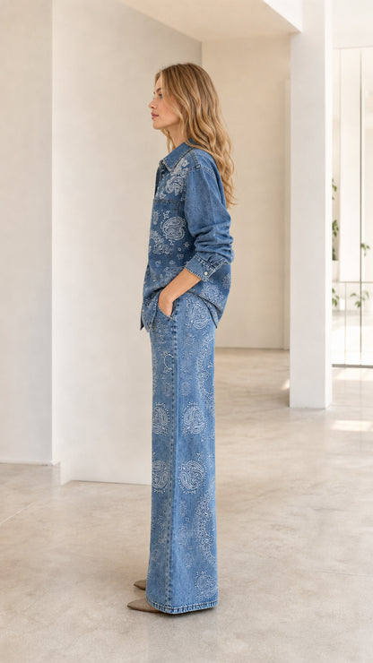 Side view of woman posing in Classic Blue paisley print denim matching set