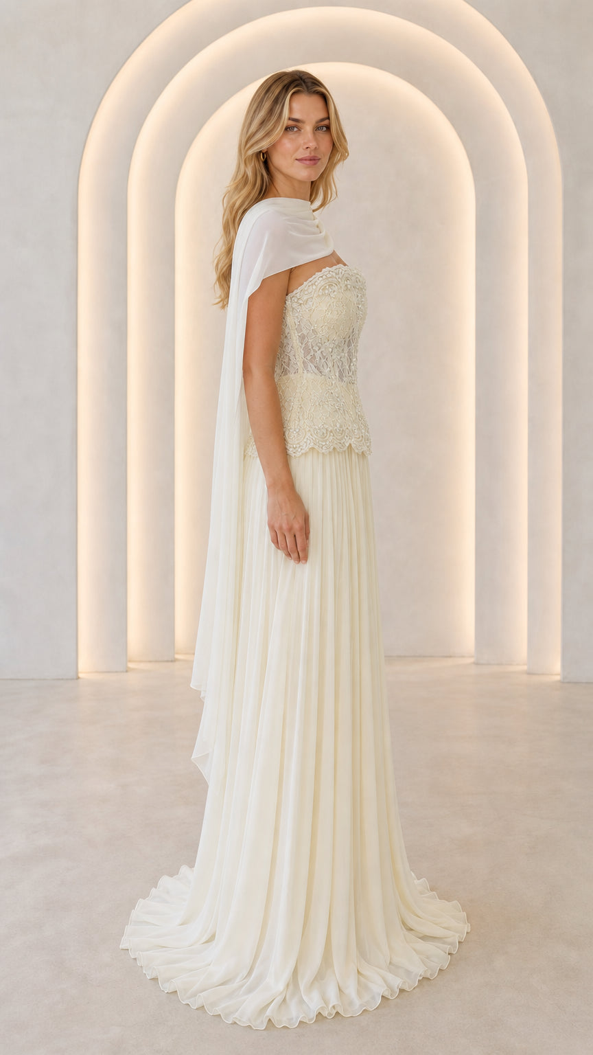 Ivory formal evening gown with lace bodice and side cape drape - three-quarter view