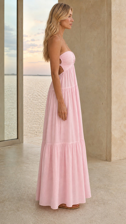 Side view of a pink open-back tiered maxi dress