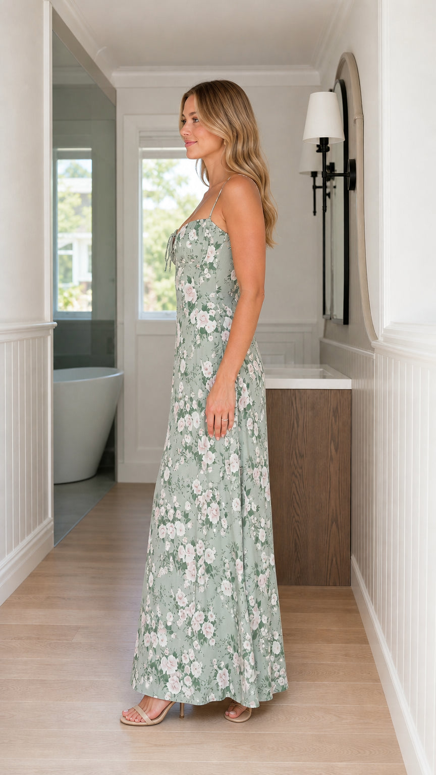 Side profile of woman in sage green floral spaghetti strap maxi dress