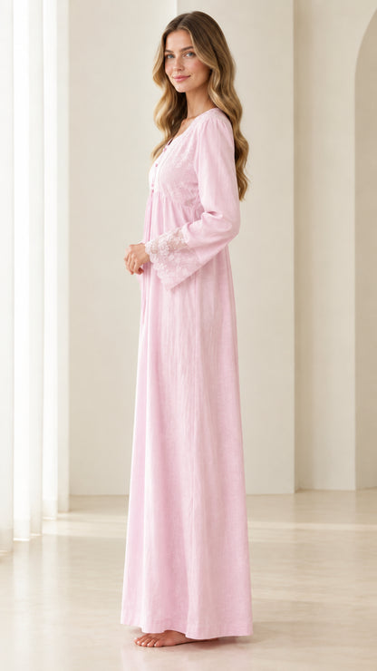 Side profile of woman in pastel pink long sleeve lace sleepwear dress