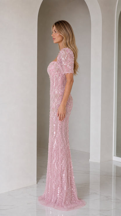 Side profile of blush pink sequin embellished mermaid formal dress