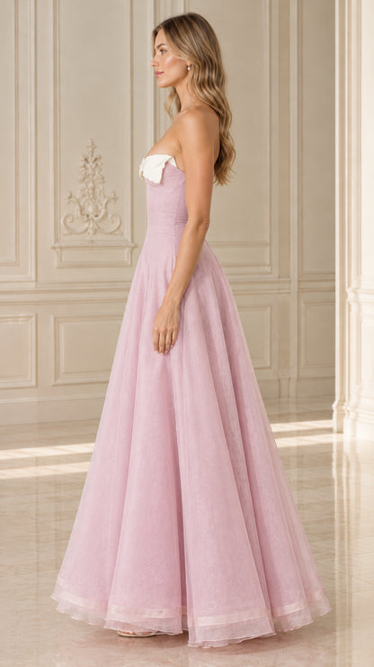Side profile of model wearing Blush Pink strapless A-line evening maxi gown