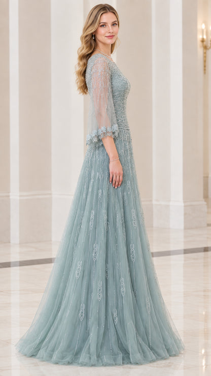 Side profile view of dusty blue floor-length beaded evening dress