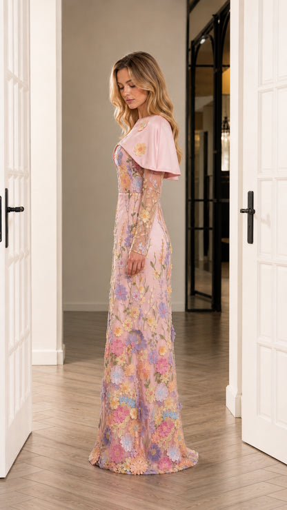 Side profile of blush pink long sleeve floral embroidered formal maxi gown with capelet