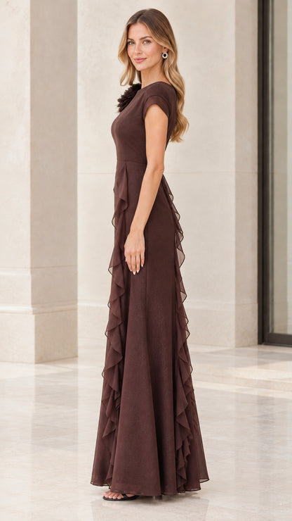 Side view of chocolate brown cap sleeve maxi formal dress with cascading side ruffles