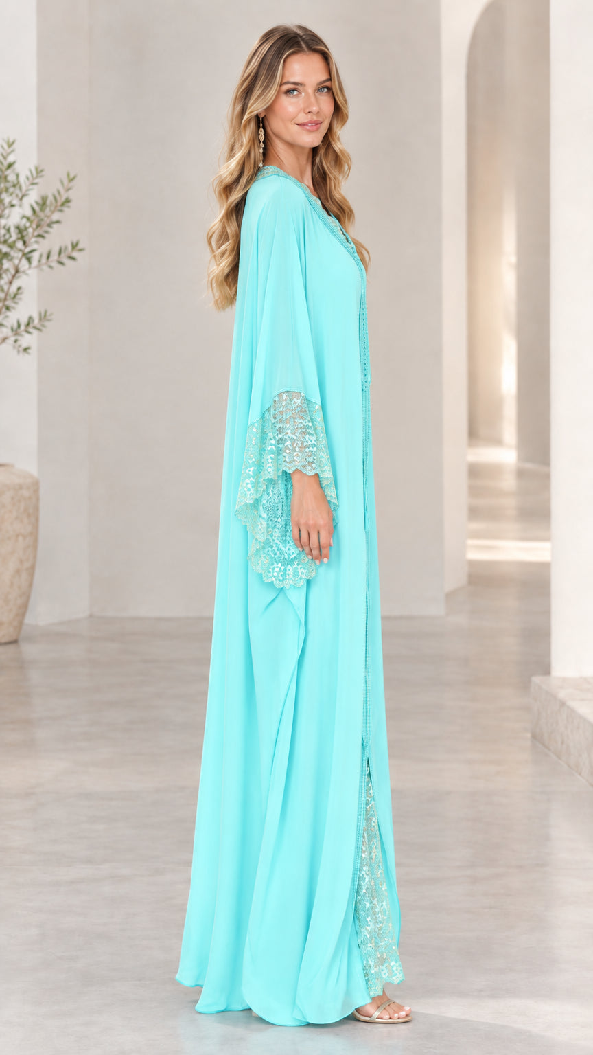 Side profile view of aqua blue flowing wide-sleeve kaftan maxi dress