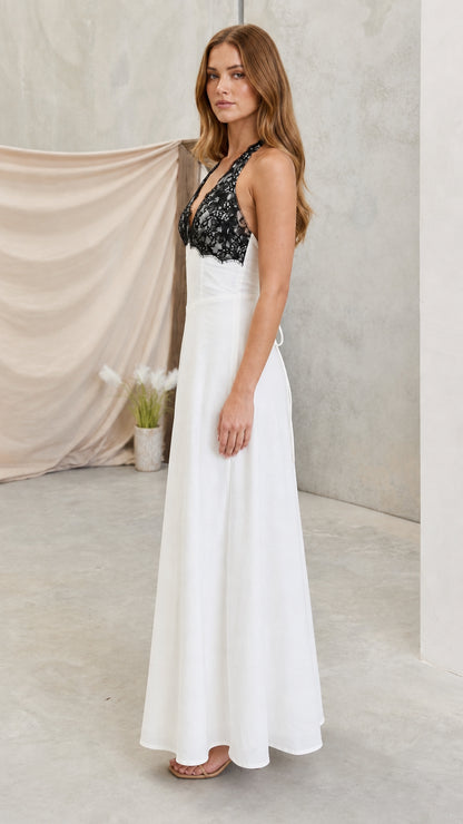 Model wearing white lace halter maxi dress side angle view