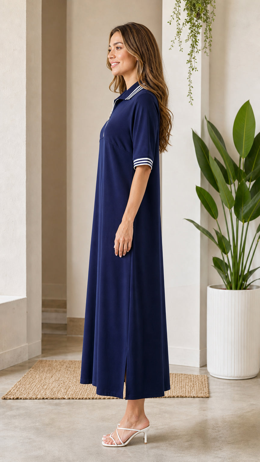 Side view of navy blue short sleeve polo maxi dress with side slit