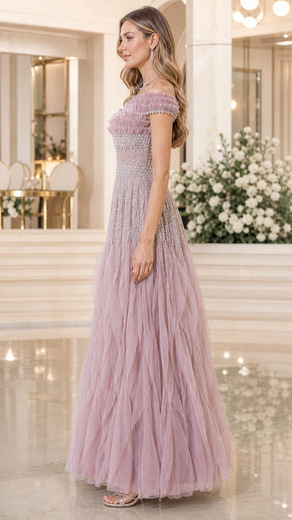 Side profile view of dusty rose evening gown
