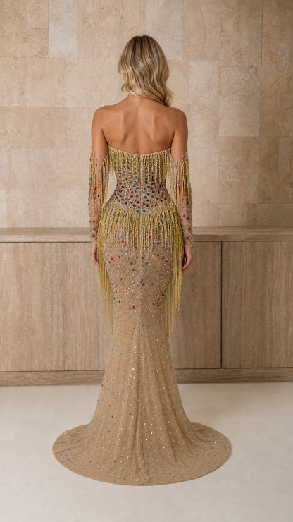 Back view of model in gold crystal-embellished gown