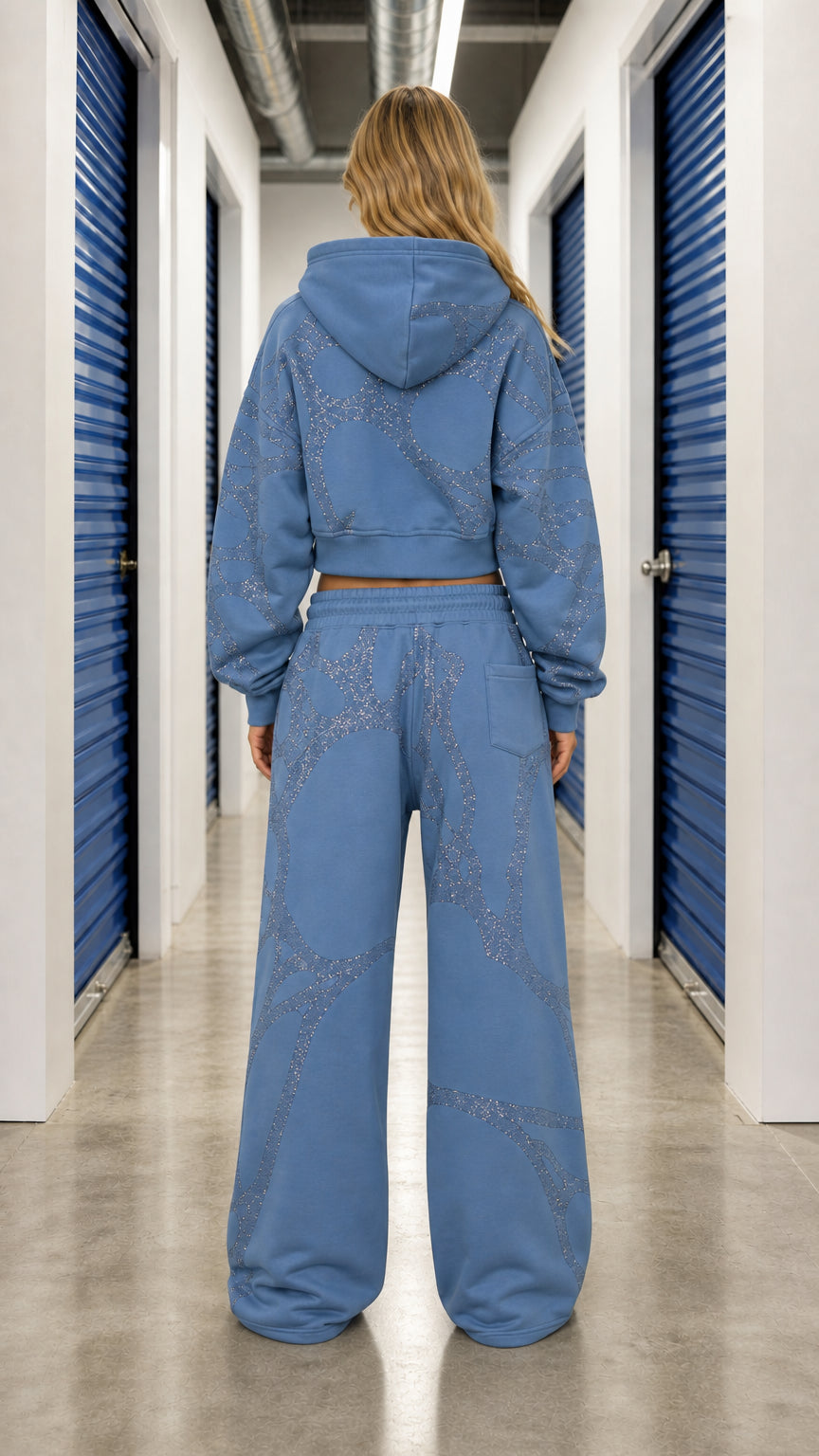 Back view of model wearing Slate Blue rhinestone hoodie and wide leg pants set