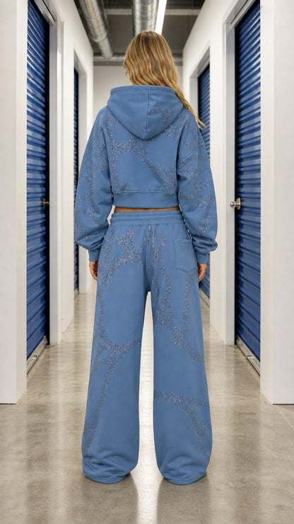 Back view of model wearing Slate Blue rhinestone hoodie and wide leg pants set