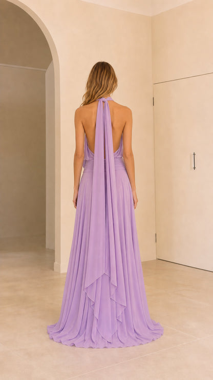 Back view of lavender halter evening dress featuring open back and cascading tie ties