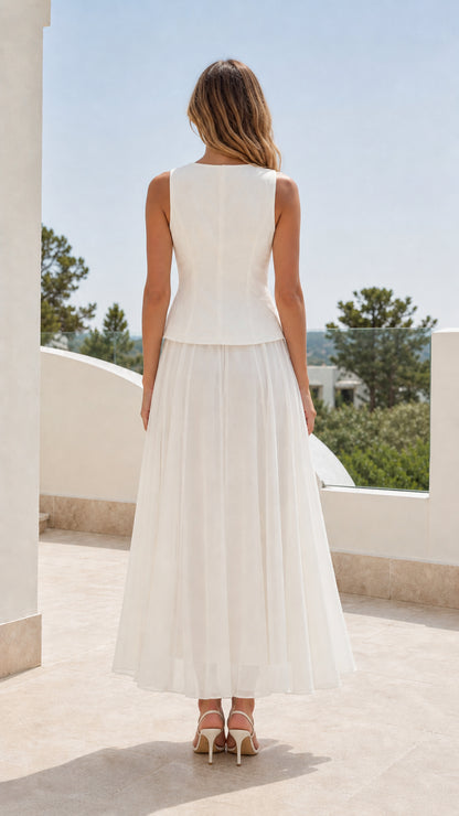 Back view of woman wearing white sleeveless skirt set
