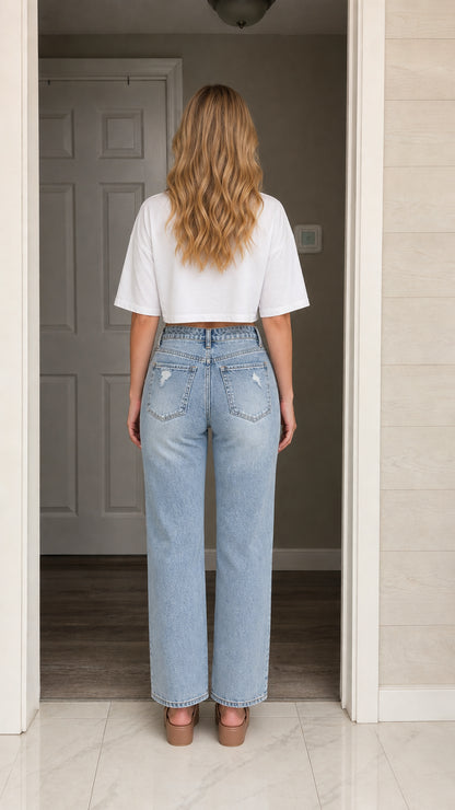 Model wearing white crop top, back view