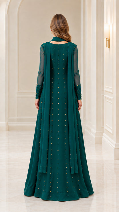 Back view of emerald green gown showing matching scarf drape