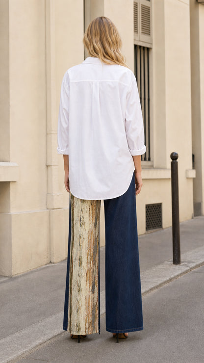 Back view of model showing the fit and contrast split panel design of wide leg jeans