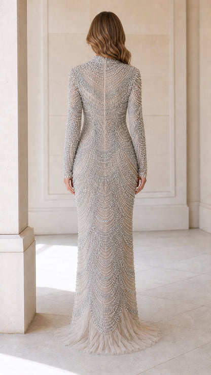Back view of Silver high neck pearl embellished gown with subtle train