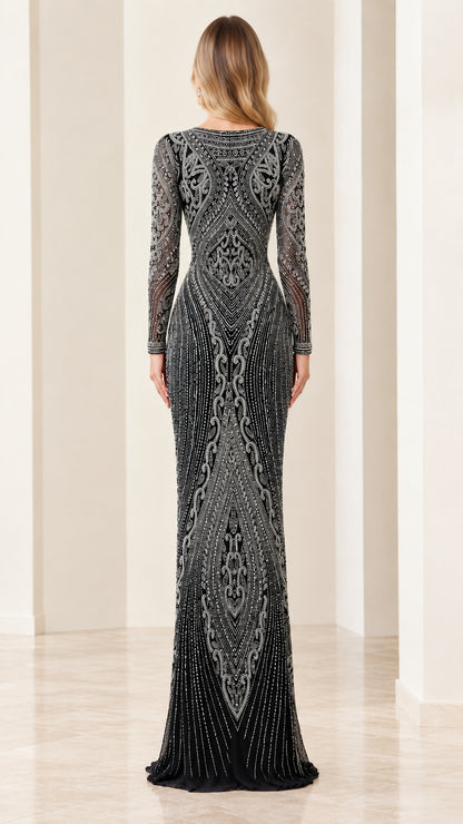 Back view of model in elegant long sleeve black beaded evening dress