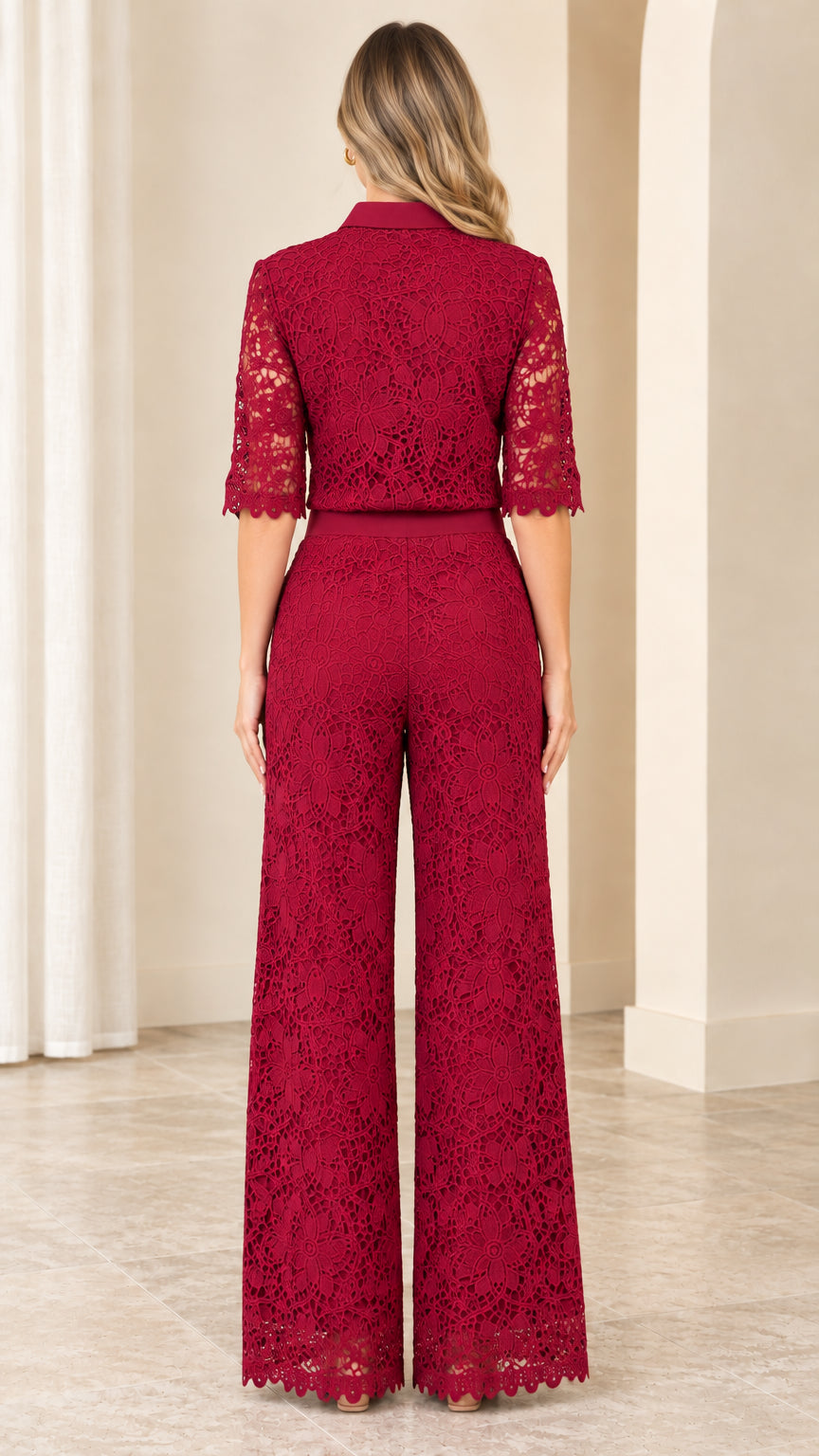Back view of woman wearing elegant burgundy lace wide-leg collared jumpsuit