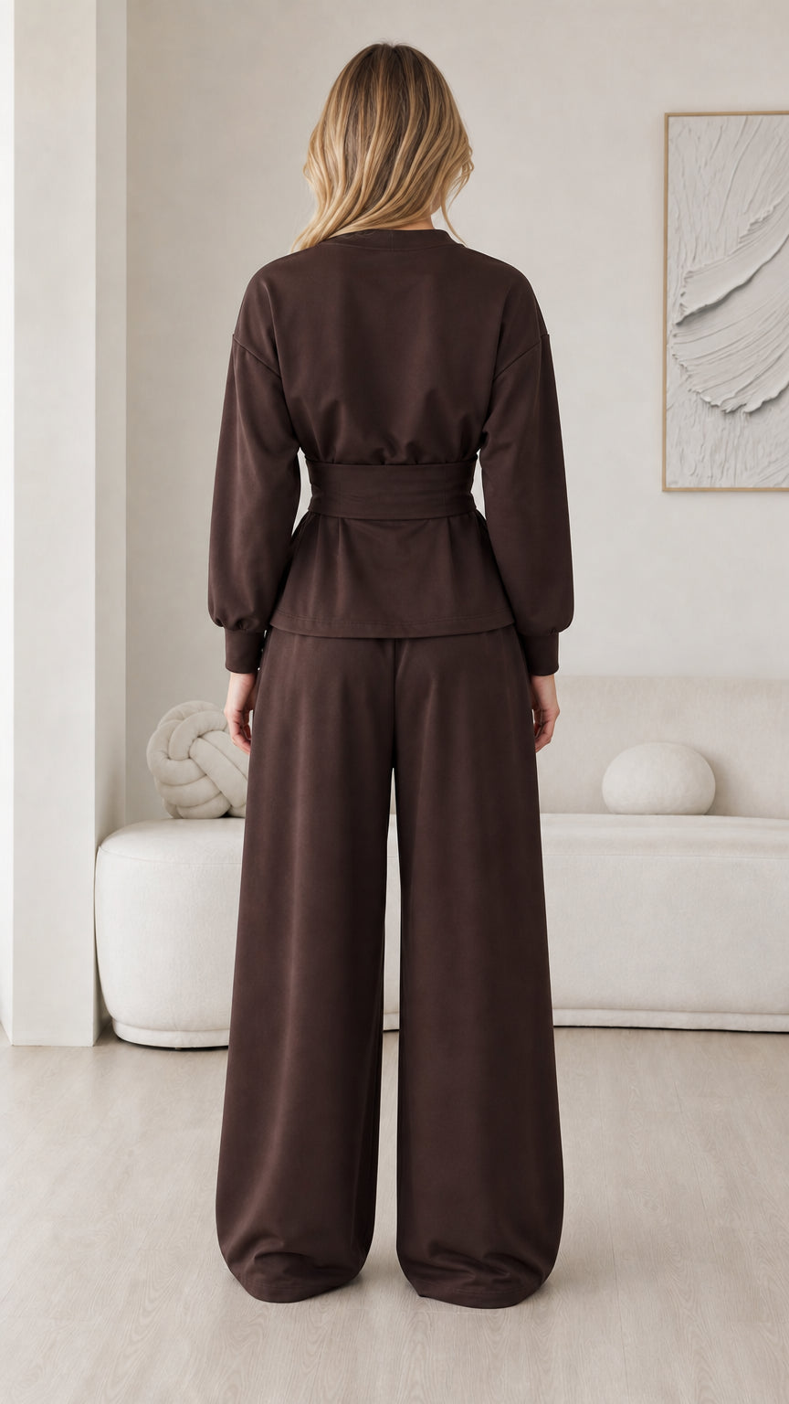 Back view of chocolate brown matching set showing relaxed cut and waist belt detail