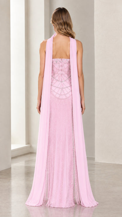 Back view of model in Blush Pink beaded evening dress highlighting long cape streamers