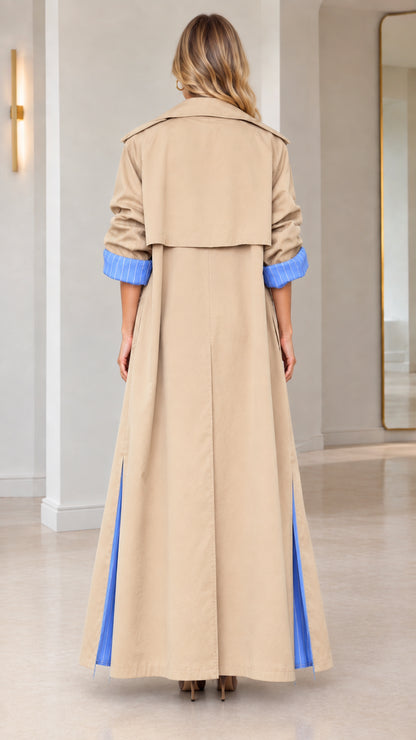Back view of camel maxi duster coat highlighting the storm flap and split hem with blue lining