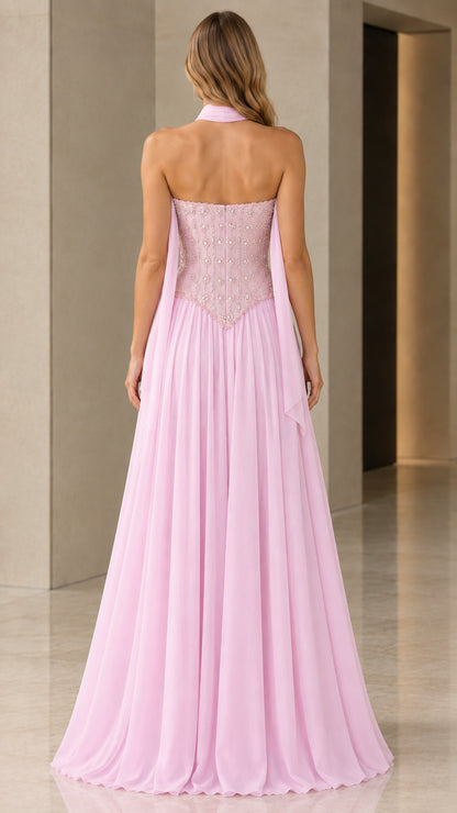 Back view of model showing drape scarf and flowing pink skirt