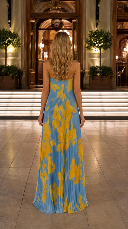 Back view of blue floral pleated maxi dress