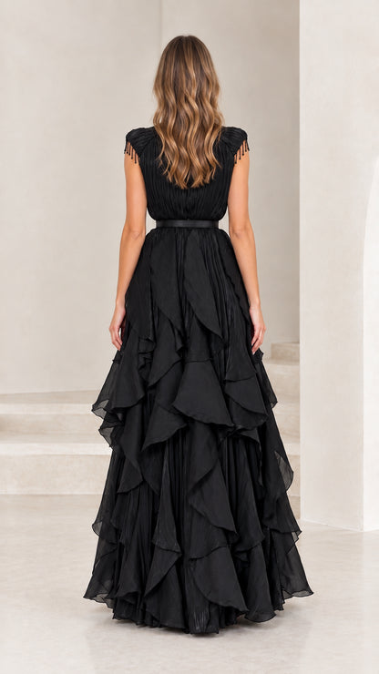 Back view of black high neck pleated tiered formal gown