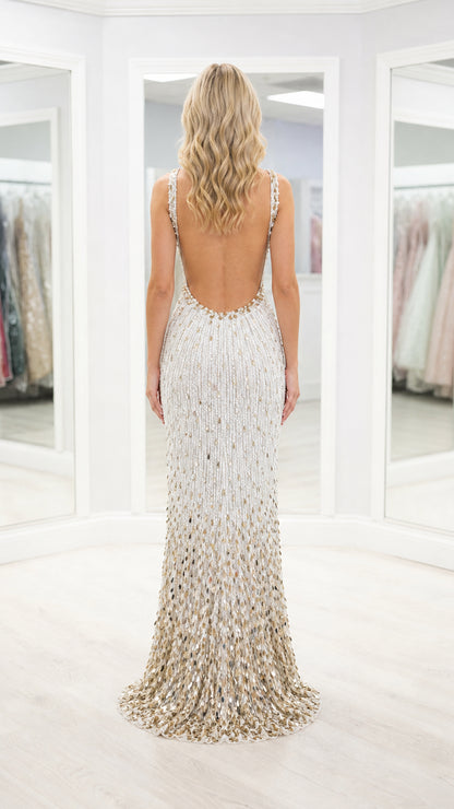 Back view of white formal gown showcasing low scoop back and puddle train