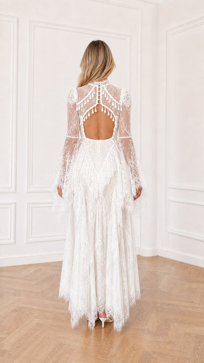 White lace maxi dress featuring open keyhole back cutout and tassel accents