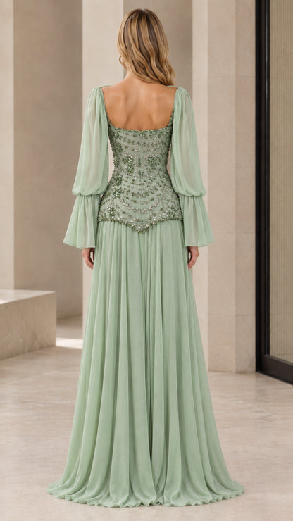 Back view of woman wearing sage green floor-length chiffon evening dress with scoop back