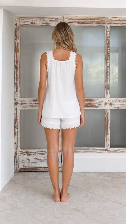 Woman wearing white lounge set back view