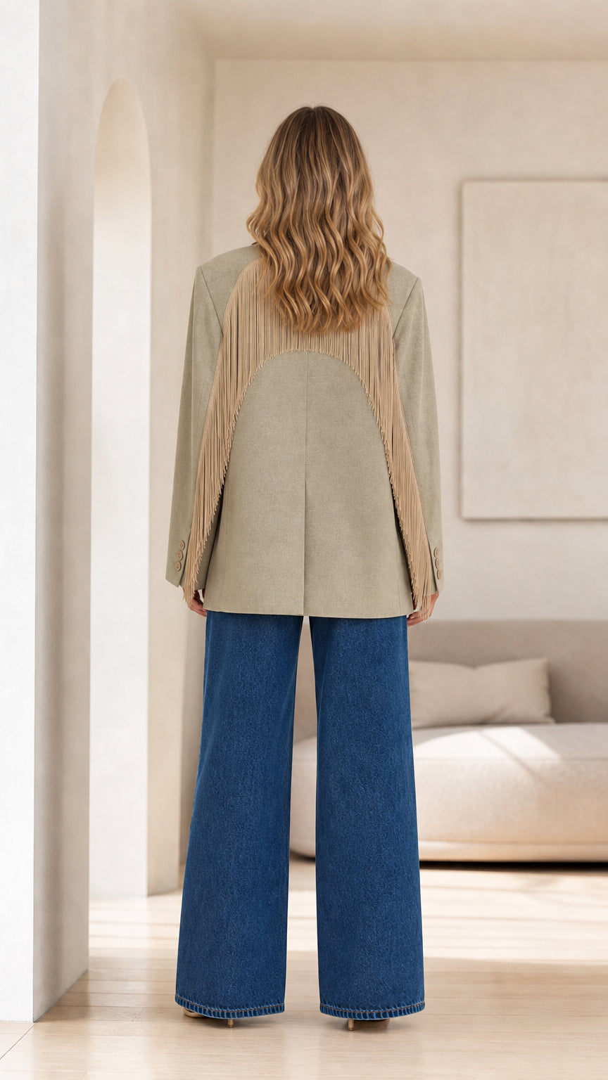 Back view of model wearing Sage Green blazer showing arched Western fringe yoke