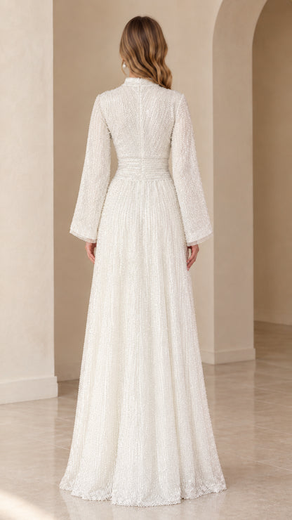 Back view of model in white sequin evening dress showing clean back silhouette