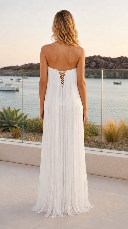 Back view of model showing lace-up tie closure on white strapless maxi dress