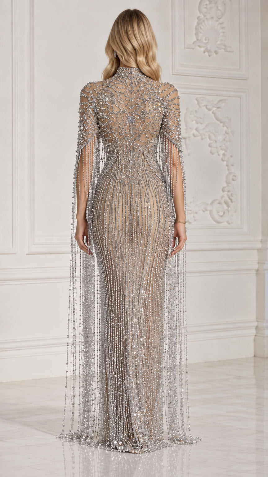 Back view of Champagne Silver embellished formal maxi gown with floor-length fringe