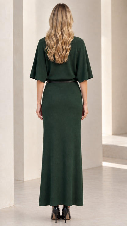 Back view of woman wearing dark green flutter sleeve knit maxi dress