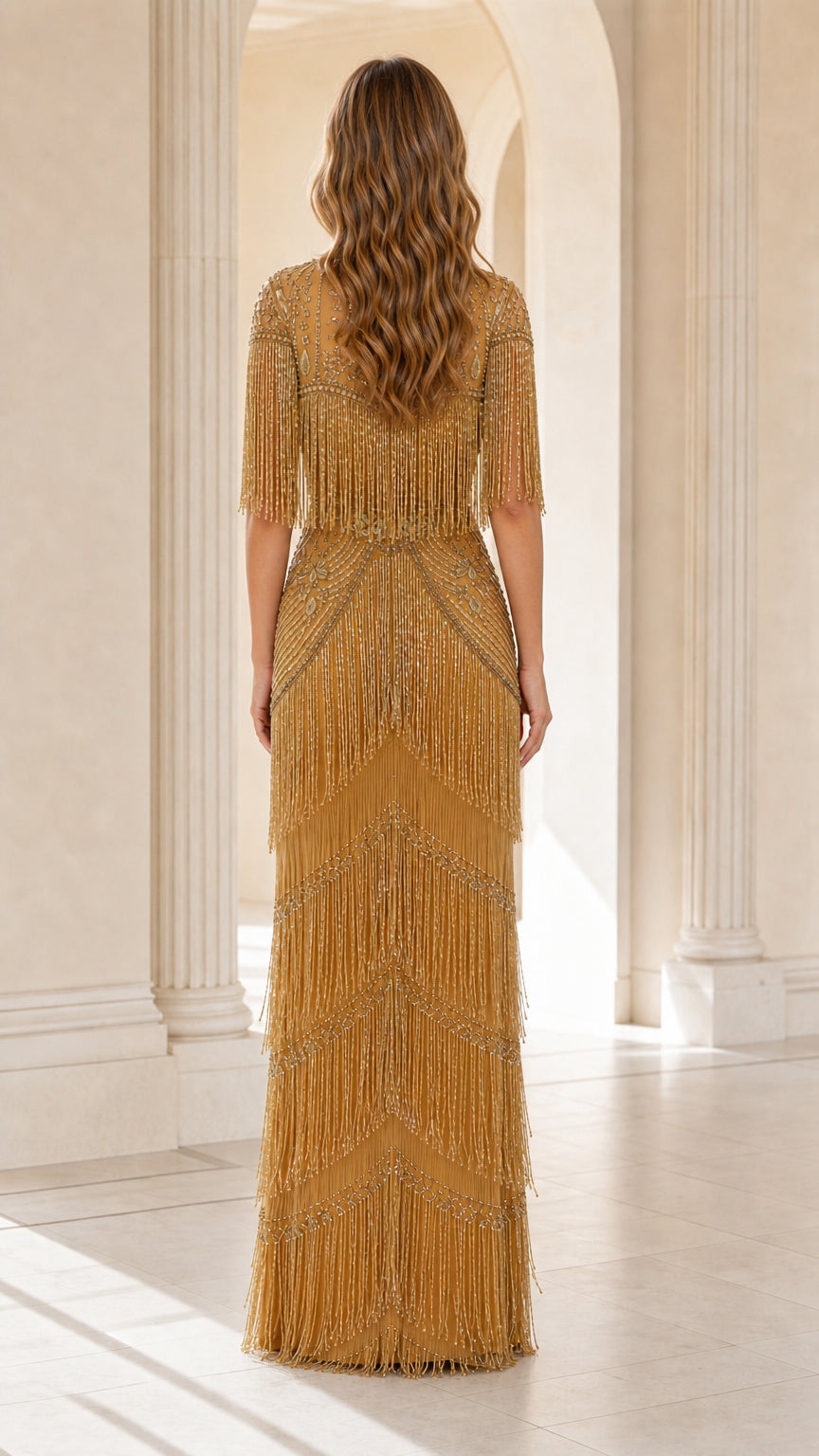 Back view of woman wearing gold tiered fringe embellished evening gown