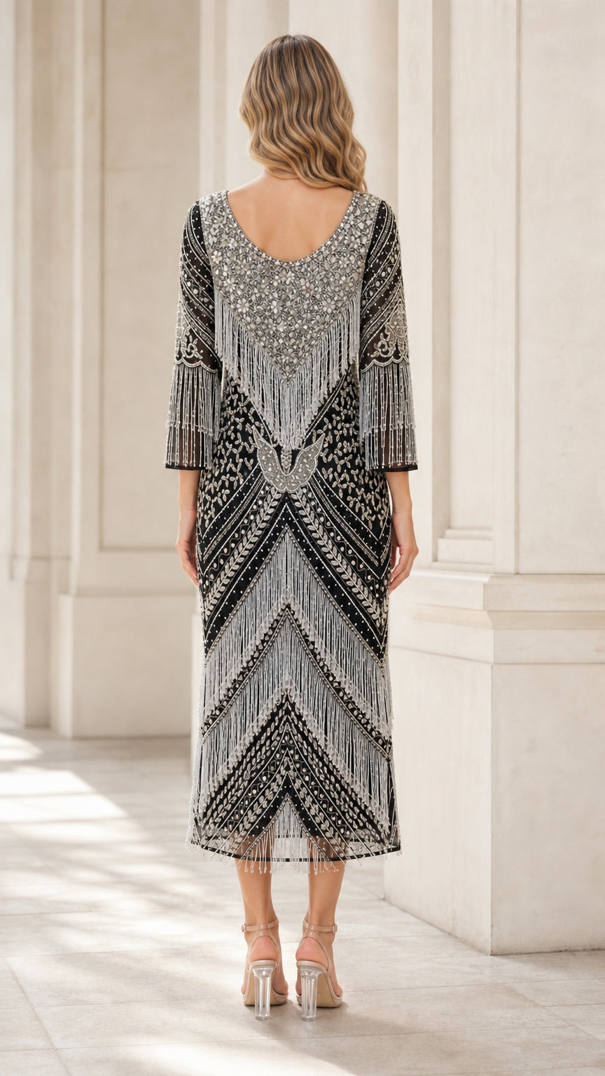 Back view of black and silver beaded flapper dress showing back scoop neckline