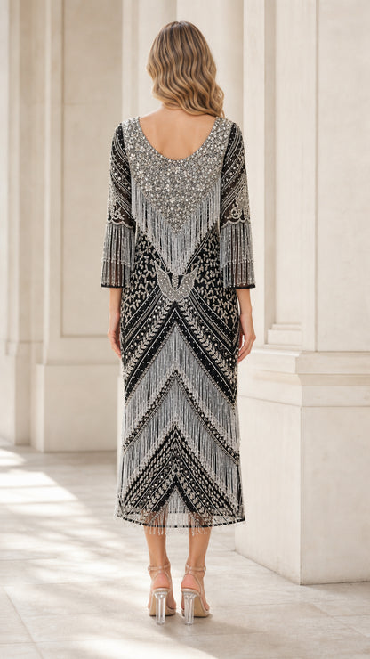 Back view of black and silver beaded flapper dress showing back scoop neckline
