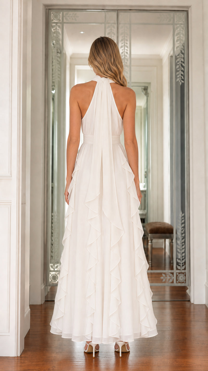 Back view of model wearing white halter neck cascading ruffle maxi dress