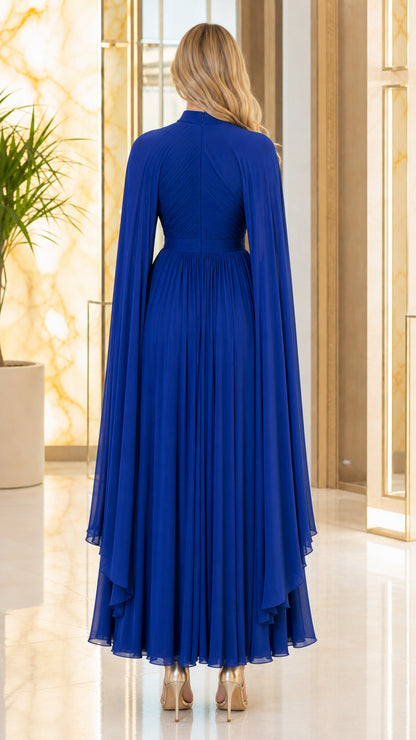 Back view of royal blue floor-length pleated cape evening gown
