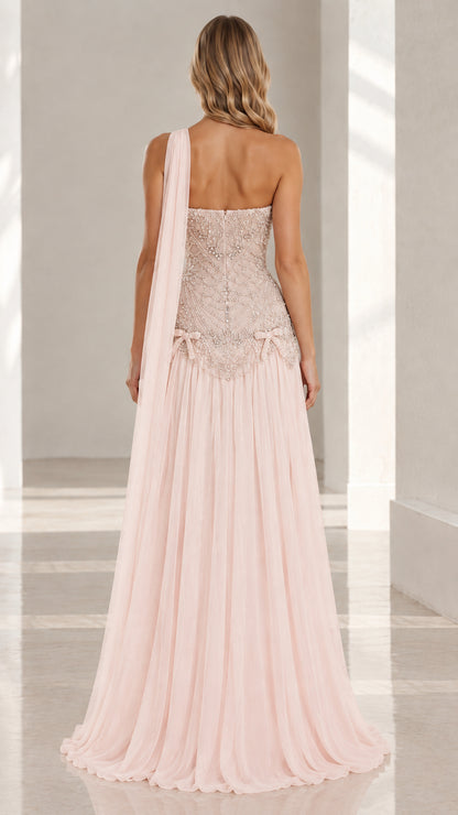Back view of blush pink evening gown with floor-length shoulder drape