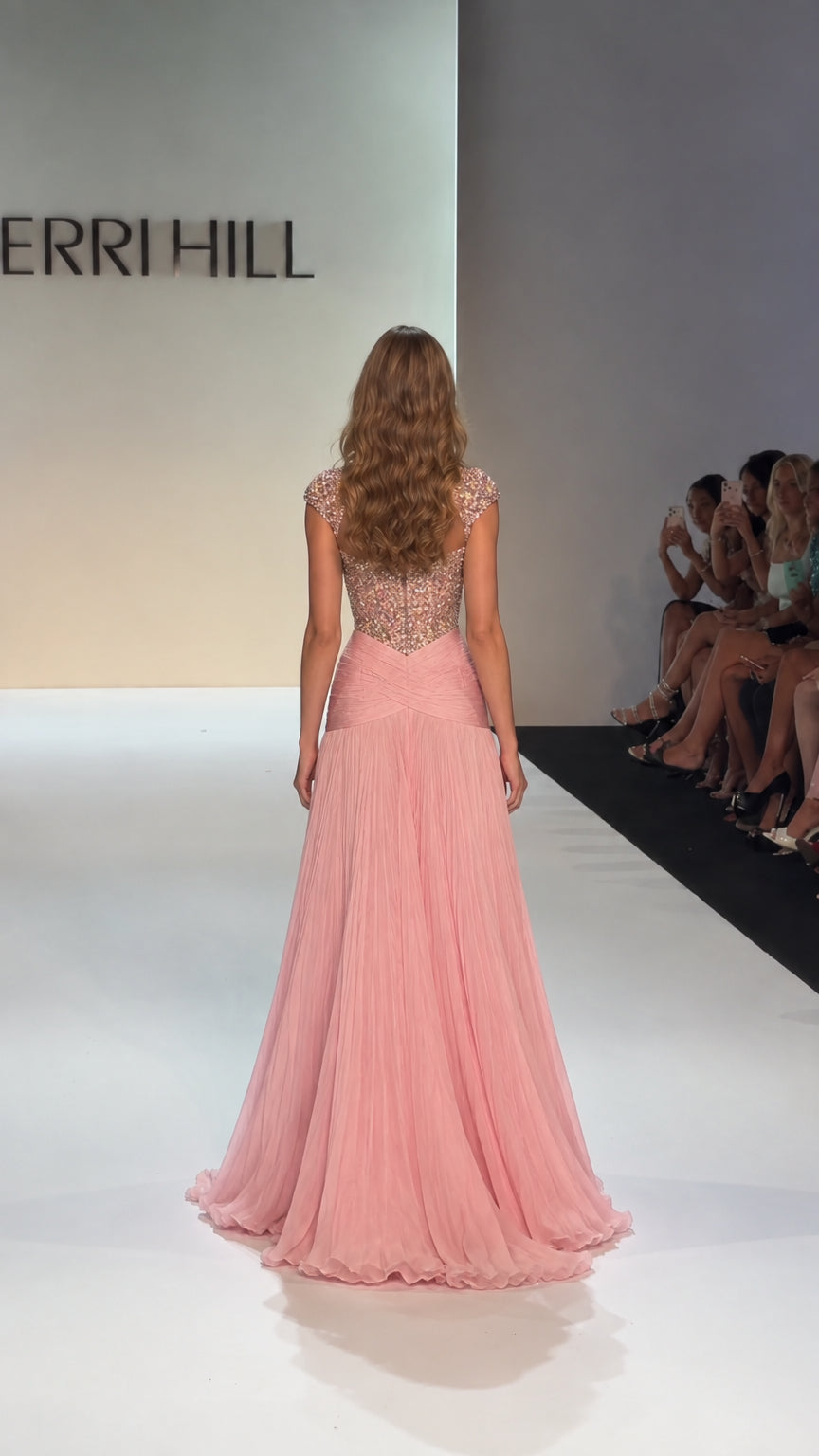 Back view of model in Blush Pink beaded evening dress with cap sleeves