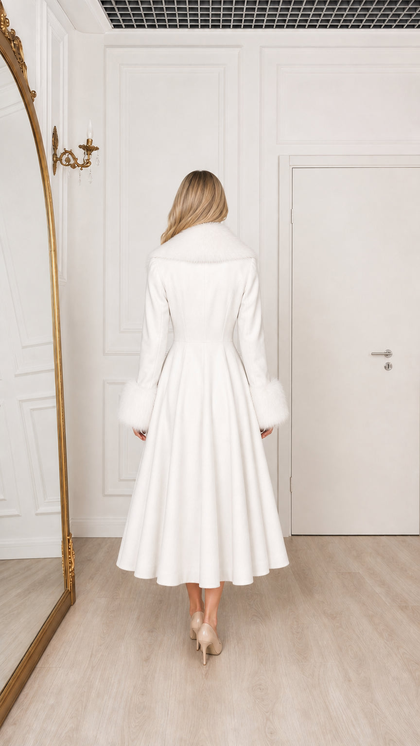 Model in white midi overcoat with fur cuffs and collar back view