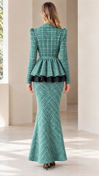 Back view of woman wearing the green tweed peplum jacket and fluted maxi skirt